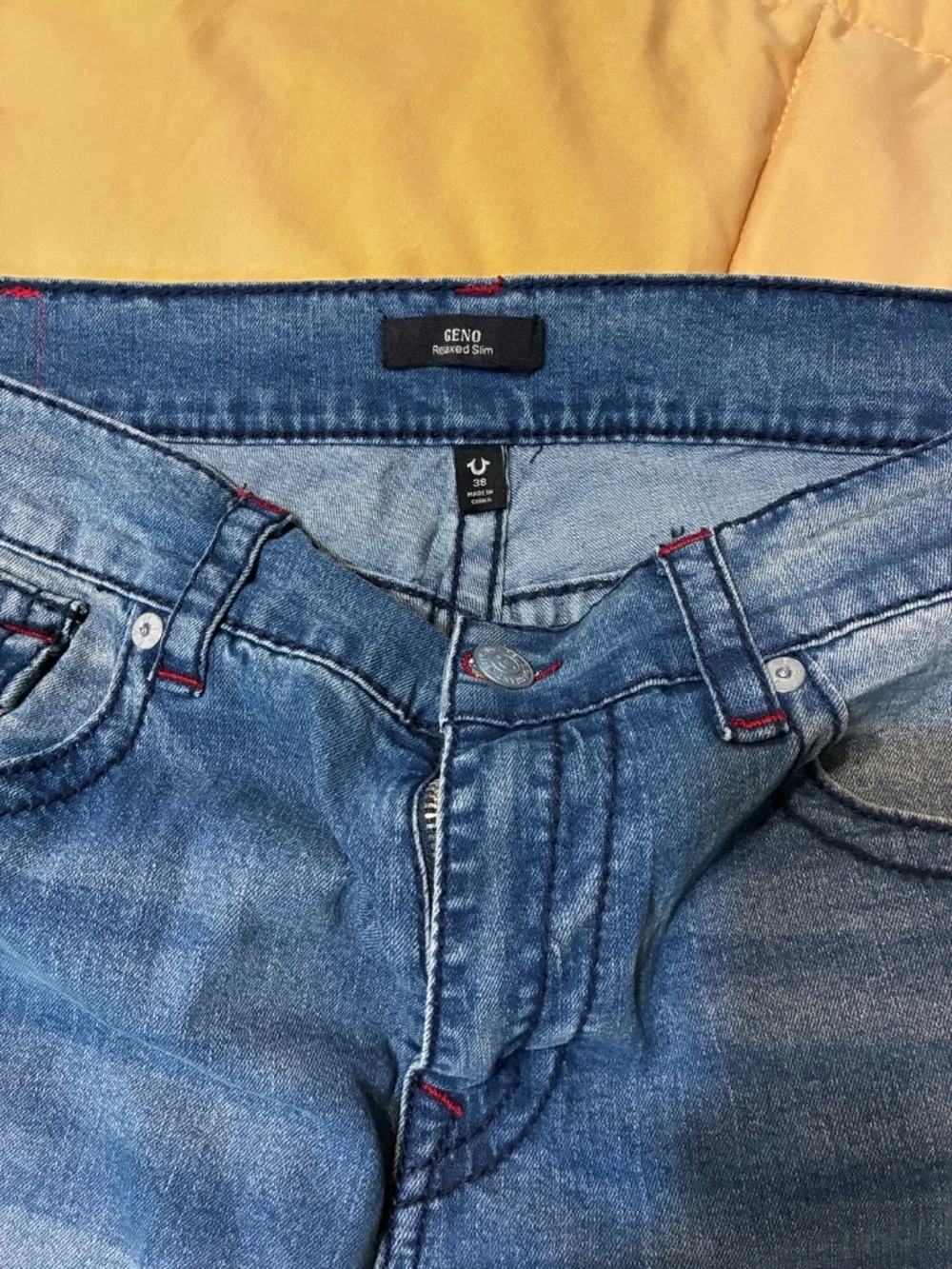 True Religion Geno Blue Jeans With Red Stitching On Back Pockets